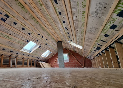 Transformation de charpente préfabriquée en W - Autre volume entièrement dégagé et étanchéité à l'air terminée